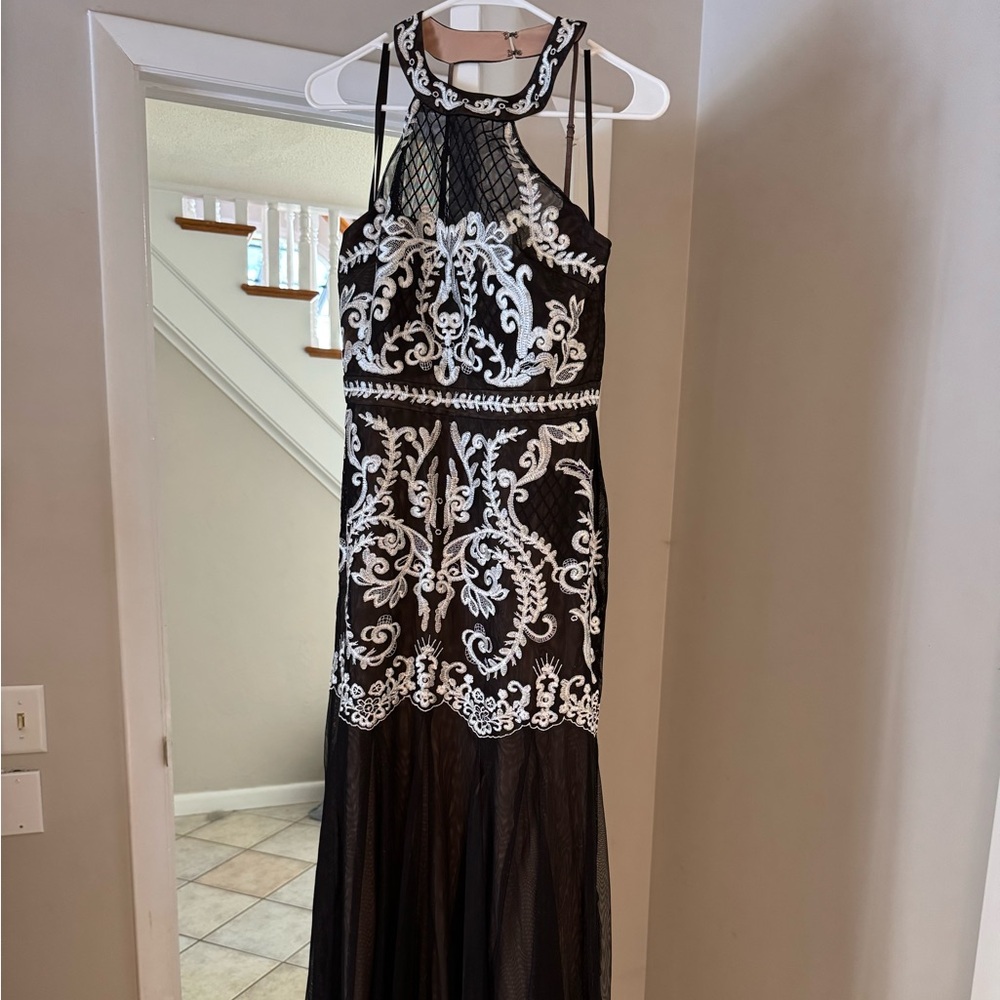 Brand new beautiful BCBG evening dress. Size 10. Sleeveless with neck collar